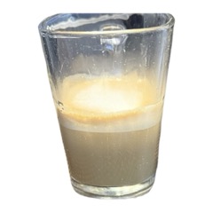 A cortado in a short glass
