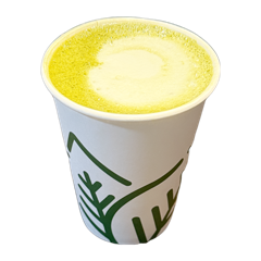 A hot matcha latte in a paper cup