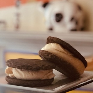 Ginger molasses cookie ice cream sandwiches on a plate
