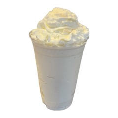 A malted milkshake topped with whipped cream