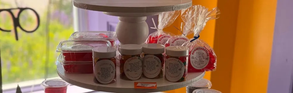 Jars of treats on a tiered stand by the window